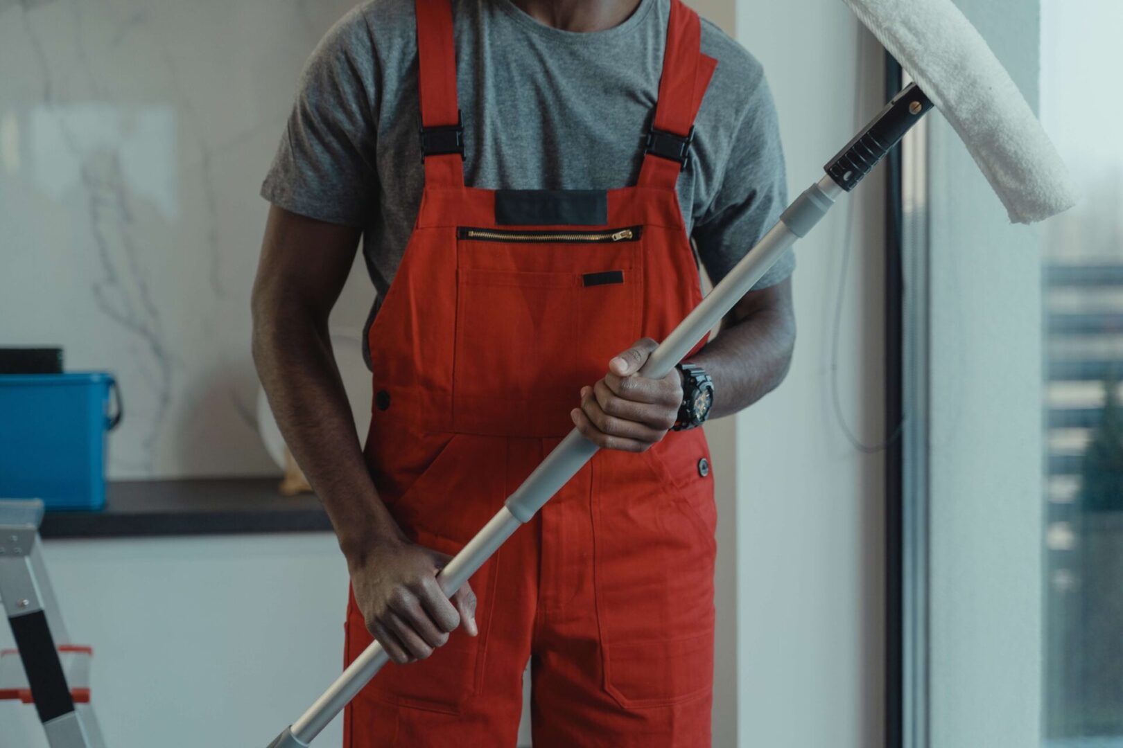 A man holding a white pole in his hands.